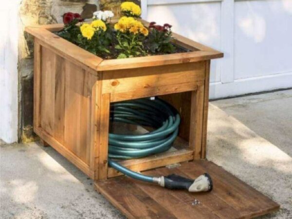 Combining Greenery and Functionality: Crafting a Wood Planter with a Convenient Hose Storage Door